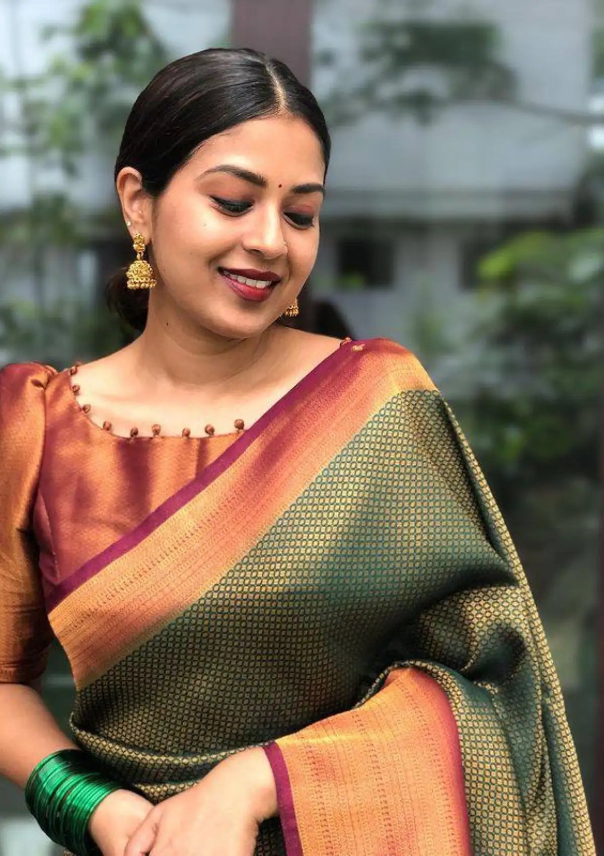 Dark Green saree with copper zari all over