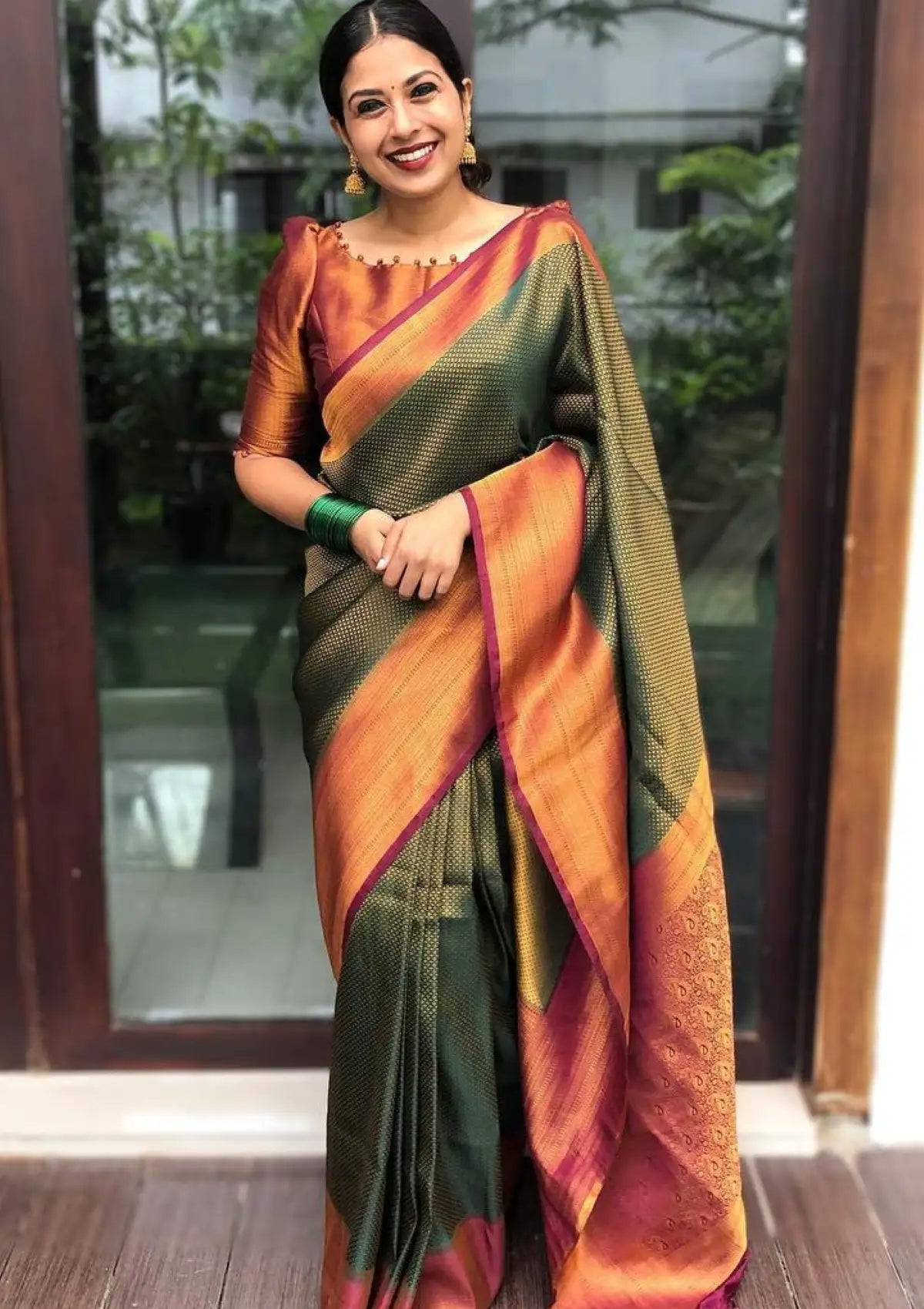 Dark Green saree with copper zari all over