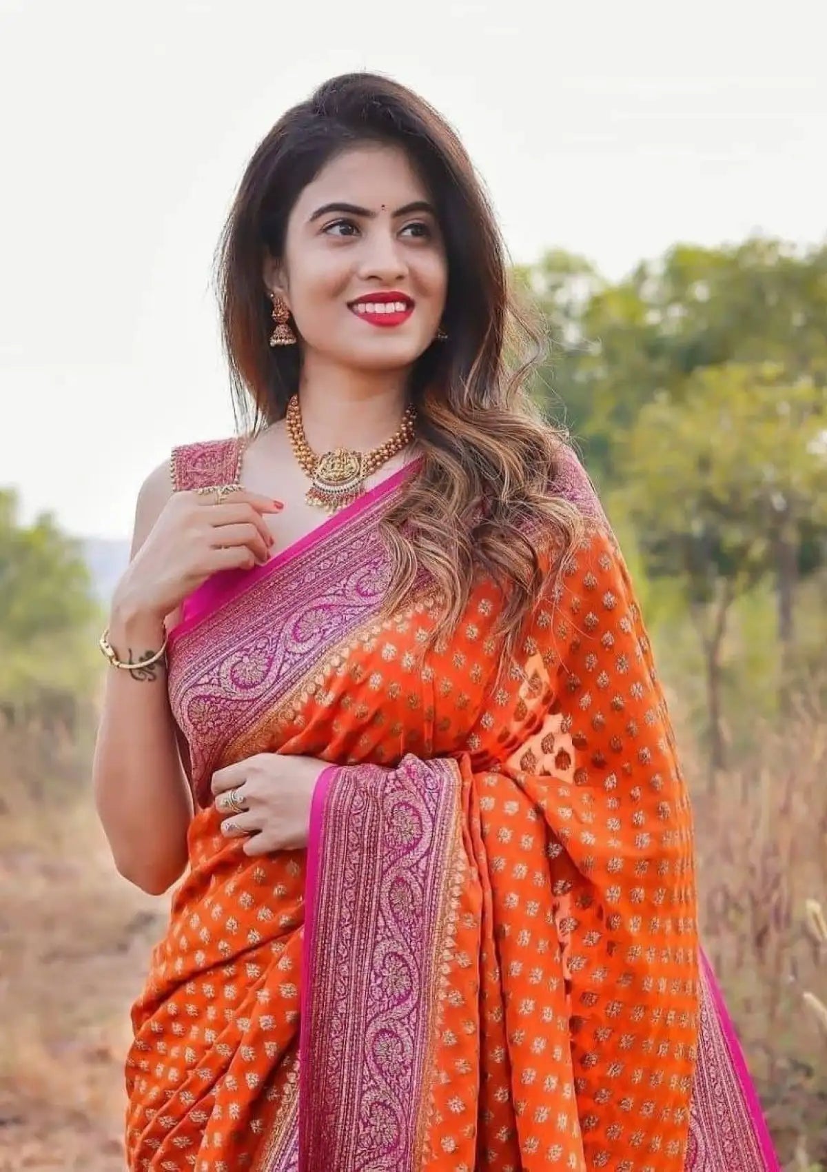 Orange Butti with Gold Saree